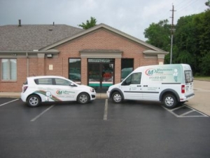 two cars in front of a building